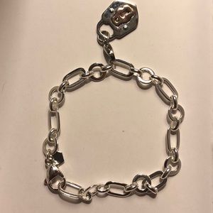 Origami owl bracelet with a lock dangle